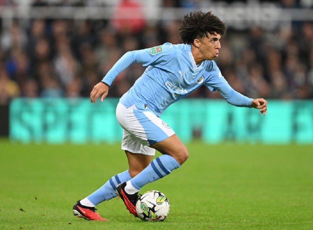 Rico Lewis playing for Manchester City.